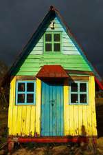 A Colorful Rustic House and Dark Storm Clouds Journal